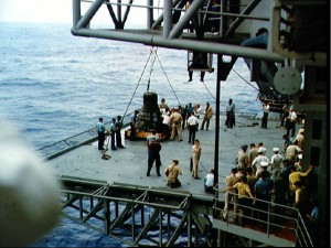 Faith 7 is lowered gently onto the deck of the USS Kearsarge, with Gordon Cooper aboard. Photo Credit: NASA