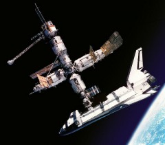 The agreements signed during the course of 1992-93 enabled this remarkable sight of a U.S. Space Shuttle docked with the Russian Mir Space Station. East and West were brought together in human space flight endeavors for the first time in almost two decades. Photo Credit: NASA
