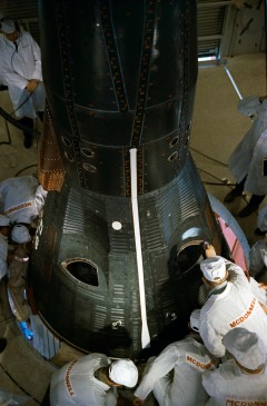 McDonnell technicians complete the final checks on Gemini 3, ahead of launch. Photo Credit: NASA