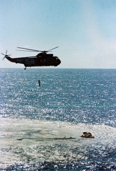 Gordo Cooper is hoisted to safety after the Gemini V splashdown on 29 August 1965. Photo Credit: NASA