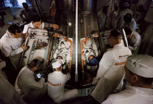 Assisted into the Gemini IV spacecraft by McDonnell technicians, this view shows the smallness of the place that Jim McDivitt and Ed White called 'home' for four days in June 1965. Photo Credit: NASA