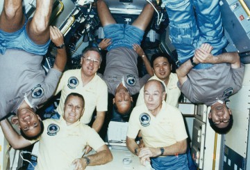 The crew of Mission 51B pose for the traditional in-flight portrait. From left to right are Fred Gregory, Bob Overmyer, Don Lind, Norm Thagard, Bill Thornton, Taylor Wang and Lodewijk van den Berg. Photo Credit: NASA, via Joachim Becker/SpaceFacts.de