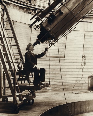 Percival Lowell, pictured in 1914 observing Venus. It was during these last two years of his life that he attempted to find Planet X...and almost succeeded. Photo Credit: Wikipedia
