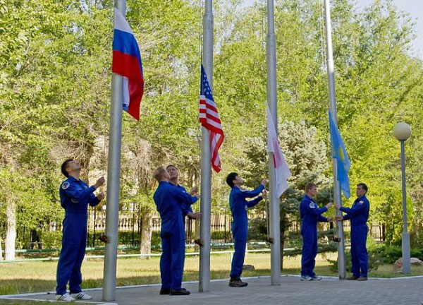The Soyuz TMA-17M prime and backup crews raise the national flags of Russia, the United States, Japan and Kazakhstan at the Baikonur Cosmodrome, earlier this month. Photo Credit: NASA