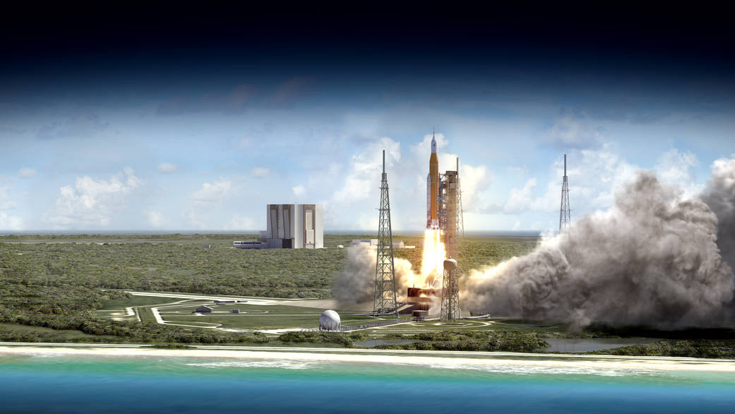 An SLS Block 1 launch vehicle hoists an Orion spacecraft from KSC's Pad 39B, with the VAB in the distance. Image Credit: NASA/MSFC