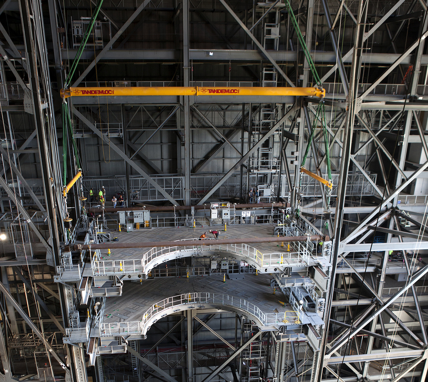 From NASA: "A heavy-lift crane lowers the second half of the D-level work platforms, D north, for NASA’s Space Launch System (SLS) rocket, into position Sept. 9 for installation in High Bay 3 in the Vehicle Assembly Building at the agency’s Kennedy Space Center in Florida." Photo Credit: NASA/Ben Smegelsky