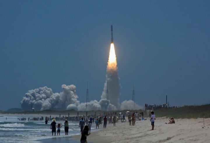 Spectators crowd the shoreline as an Atlas 5 rocket launches NASA's JUNO spacecraft to Jupiter, as photographed from Playalinda Beach. Photo Credit: Mike Killian