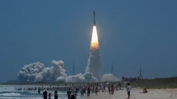 An Atlas 5 rocket launches NASA's JUNO spacecraft to Jupiter, as viewed from Playalinda Beach. Photo Credit: Mike Killian