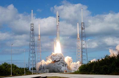 The launch of New Horizons in 2006 atop an Atlas 5 rocket from Cape Canaveral, FL. The spacecraft left Earth at the greatest ever launch speed for a man-made object. Photo Credit: NASA / KSC