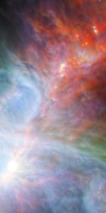 Young stars in the Orion Nebula. The rainbow of colors represents different wavelengths of infrared light captured by both the European Space Agency's Herschel Space Observatory and NASA's Spitzer Space Telescope. Image credit: NASA/ESA/JPL-Caltech/IRAM