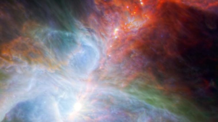 Young stars in the Orion Nebula. The rainbow of colors represents different wavelengths of infrared light captured by both the European Space Agency's Herschel Space Observatory and NASA's Spitzer Space Telescope. Image credit: NASA/ESA/JPL-Caltech/IRAM