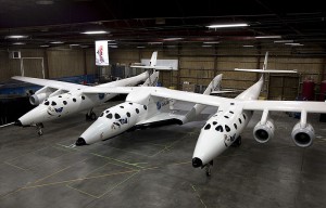 SpaceShipTwo resting under the Mothership White Knight Two inside a hangar in Mojave,Ca. USA. Photo Credit: Virgin Galactic/Mark Greenberg