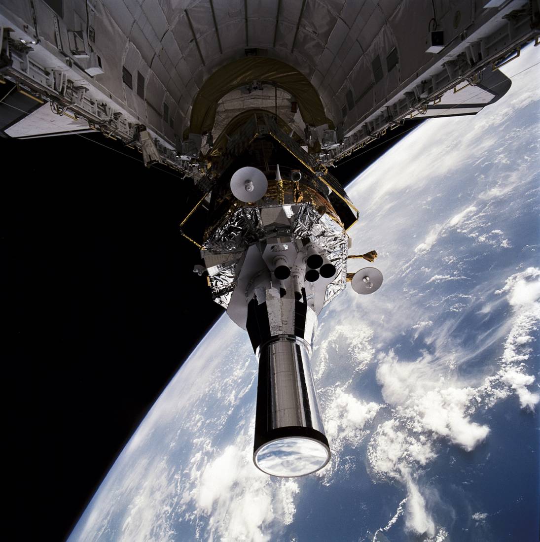 The Defense Support Program (DSP) satellite, attached to is Boeing-built Inertial Upper Stage (IUS) booster, is deployed from Atlantis' payload bay at the beginning of the STS-44 mission. Photo Credit: NASA