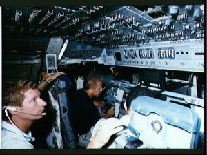 Steve Hawley (left) and Loren Shriver are pictured in the cockpit of the shuttle simulator during STS-31 training in July 1988. Photo Credit: NASA  