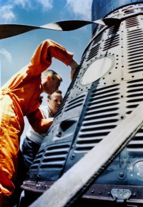 On the deck of the U.S.S. Lake Champlain, Alan Shepard checks out the interior of Freedom 7 - the vehicle which had protected him from the rigours of a launch and high-G acceleration, had kept him alive and well in the most hostile environment ever encountered by humanity and sustained him throughout a perilous descent from orbit. Photo Credit: NASA