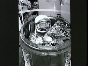 Ordinarily, Mercury astronauts departed their craft through the side hatch, but Carpenter was the only one to exit through the nose. He is pictured demonstrating the procedure during pre-flight training. Photo Credit: NASA