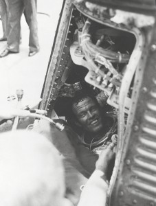 Gordon Cooper, the hotshot final pilot of Project Mercury, grins at recovery personnel after his 34-hour mission. Faith 7 would prove one of the high points of his astronaut career. Photo Credit: NASA