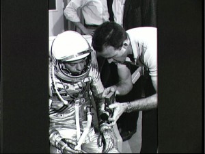 During training, Gordon Cooper (right) discusses one of the mission's cameras with his backup, Alan Shepard. Photo Credit: NASA