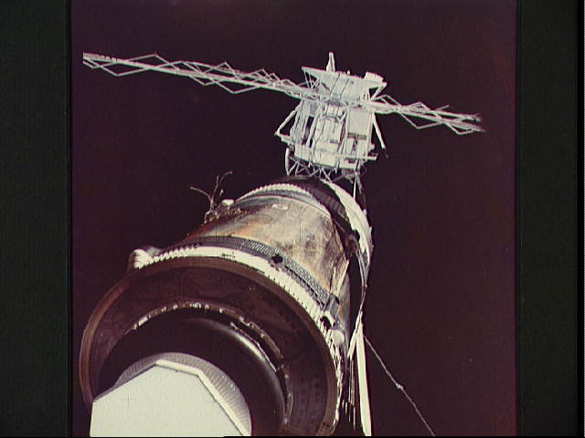 Although the deployment of the Apollo Telescope Mount (ATM), in the background, was considered relatively complex in terms of its criticality, no one could have foreseen that Skylab's solar arrays and micrometeoroid shield would almost ruin the mission. In this view from Pete Conrad's crew, the tattered wiring and tubing from the torn solar array are clearly visible. Photo Credit: NASA
