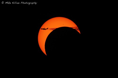 What appears to be a 747 airliner passing through the crescent eclipsed sun. Photo Credit: Mike Killian / ARES Institute and AmericaSpace