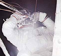 The sheer audacity of the EVAs performed by Skylab's first crew should not be underestimated. In spite of the extravehicular experience gained on Apollo and Gemini, very little "repair" work had ever been done, and none as intricate and mission-critical as that which Skylab demanded. Here, Joe Kerwin works to free the jammed solar array. Photo Credit: NASA 
