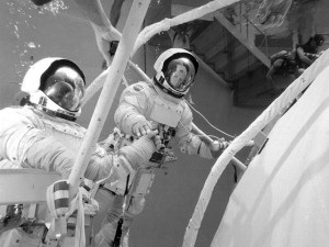 In the hectic ten days between the launch of Skylab and the launch of Pete Conrad's crew, NASA and its contractors rose spectacularly to one of the greatest challenges in their history. In the water tank at the Marshall Space Flight Center, astronauts Rusty Schweickart and Ed Gibson practice repair techniques. Photo Credit: NASA 