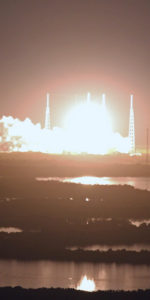 The SpaceX Falcon-9 rocket ignites to send their Dragon spacecraft on the first commercial spaceflight to the International Space Station, as shot from a 920th Rescue Wing Pave Hawk helicopter - call sign Jolly 1. Photo Credit: Mike Killian / ARES Institute and AmericaSpace