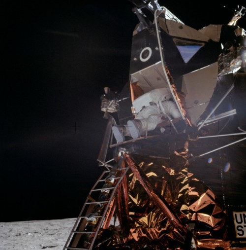 Neil Armstrong's departure from Eagle was followed, 16 minutes later, by Buzz Aldrin. Many of the Moonwalkers described the laborious process of backing themselves through the hatch and onto the lunar module's porch as like being born. Photo Credit: NASA