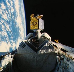 The American Satellite Company's ASC-1 communications satellite spins out of Discovery's payload bay, early in the 51I mission. Note the Pacman-like jaws of the satellite's protective sunshield. Photo Credit: NASA
