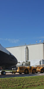 Space shuttle's Atlantis and Endeavour, face-to-face for the last time as they swaped locations at Kennedy Space Center this morning. Atlantis was moved back to the OPF to finish out her retirement processing, and Endeavour was moved into the VAB to await her flight to California next month. Photo Credit: Mike Killian for Zero-G News and AmericaSpace