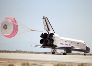 The shuttle's first drag chute blossoms from Endeavour during rollout on 16 May 1992. Photo Credit: NASA