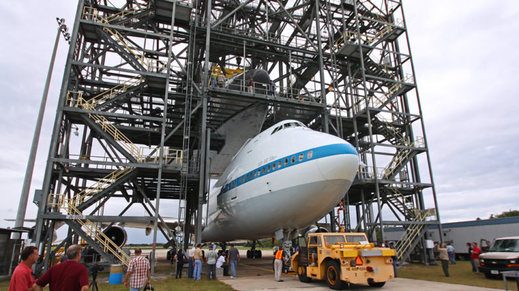 Endeavour, raised roughly 60-feet in the air, ready to be mated to NASA's 747 Shuttle Carrier Aircraft Friday afternoon. Photo Credit: Mike Killian / Zero-G News and AmericaSpace
