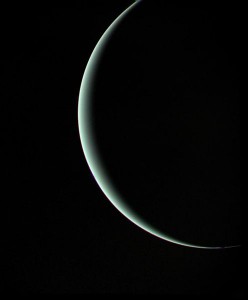 Viewed from 600,000 miles (965,000 km) beyond the planet on 25 January 1986, Uranus presents itself as a mere sliver of a crescent to Voyager 2's cameras. Photo Credit: NASA