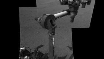 The extended robotic arm of NASA's Mars rover Curiosity can be seen in this mosaic of full-resolution images from Curiosity's Navigation camera (Navcam). The 7-foot-long (2.1-meter-long) arm maneuvers a turret of tools including a camera, a drill, a spectrometer, a scoop and mechanisms for sieving and portioning samples of powdered rock and soil. Photo Credit: NASA/JPL-Caltech