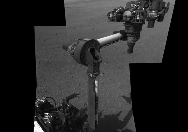 The extended robotic arm of NASA's Mars rover Curiosity can be seen in this mosaic of full-resolution images from Curiosity's Navigation camera (Navcam). The 7-foot-long (2.1-meter-long) arm maneuvers a turret of tools including a camera, a drill, a spectrometer, a scoop and mechanisms for sieving and portioning samples of powdered rock and soil. Photo Credit: NASA/JPL-Caltech