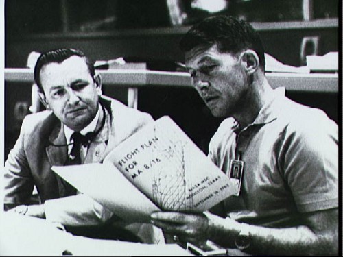Schirra (right) consults the flight plan for his Mercury-Atlas-8 (MA-8) mission with Flight Director Chris Kraft. Photo Credit: NASA