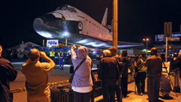 Large crowds lined the streets of LA early this morning to get a glimpse of Endeavour's historic journey through the city. Photo Credit: Mike Killian / Zero-G News