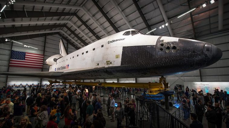 Guests walk around space shuttle Endeavour after the grand opening ceremony for the California Science center, Tuesday, Oct. 30, 2012, in Los Angeles. Photo Credit: NASA / Bill Ingalls