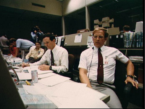 Pictured during a 56-hour simulation in late August 1988, astronauts Pierre Thuot and Mark Lee - both members of the STS-26 Capcom team - monitor their displays and notes. Photo Credit: NASA
