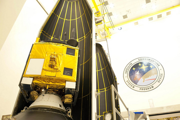 GPS IIF-3 - similar to the satellite scheduled for Wednesday's mission - is pictured during 'encapsulation' within the two-piece payload fairing. Photo Credit: United Launch Alliance