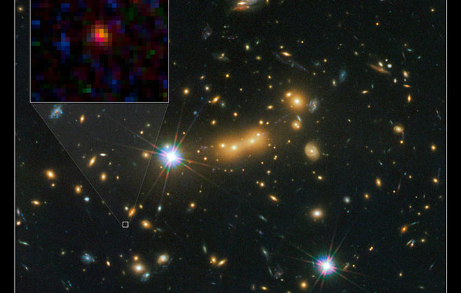 The newly discovered galaxy, named MACS0647-JD, is very young and only a tiny fraction of the size of our Milky Way. The object is observed 420 million years after the big bang. The inset at left shows a close-up of the young dwarf galaxy. This image is a composite taken with Hubble's WFC 3 and ACS on Oct. 5 and Nov. 29, 2011. Photo Credit: NASA, ESA, and M. Postman and D. Coe (STScI) and CLASH Team.