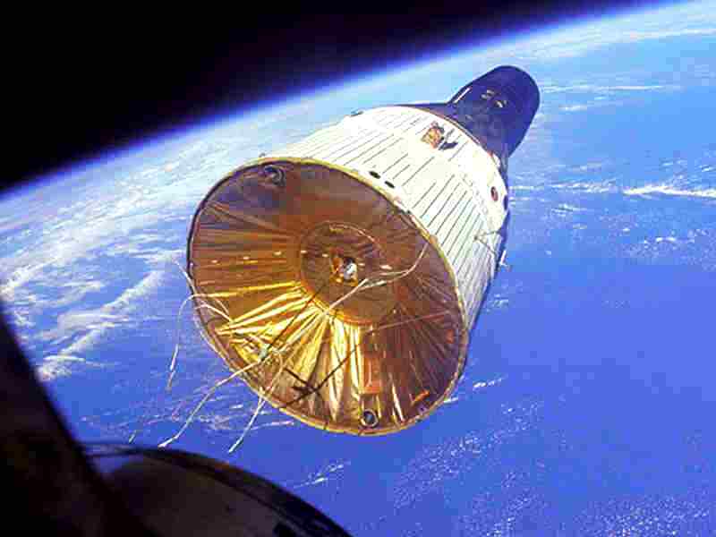 Gemini VII, bearing astronauts Frank Borman and Jim Lovell on a record-breaking 14-day mission, is seen through the windows of Gemini VI-A, with fellow spacefarers Wally Schirra and Tom Stafford. This mission, in December 1965, marked the first "true" rendezvous between two piloted vehicles in orbit. Photo Credit: NASA