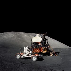 The last three Apollo lunar landing crews - 15, 16 and 17 - could not have accomplished their scientific explorations and returned their geological bonanzas without the aid of the battery-powered lunar rover. In this view from EVA-1, Gene Cernan puts the vehicle through its first tests, backdropped by the lunar module Challenger. Photo Credit: NASA