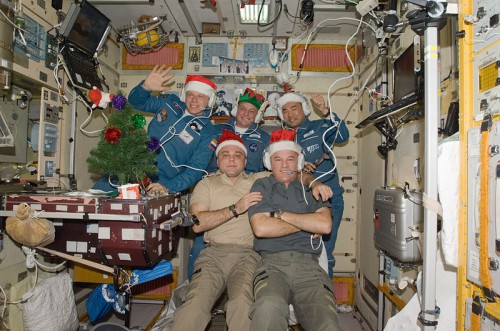 Expedition 22 crewmen, including the first Japanese astronaut to spend Christmas in orbit, Soichi Noguchi, pose with costumes and decorations, three days ahead of the big day in 2009. Note Timothy "T.J." Creamer's elven ears. Photo Credit: NASA