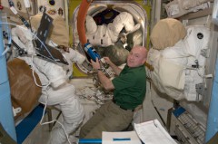 Andre Kuipers, the first Dutchman to celebrate the New Year in space, works in the station's Quest airlock during his six-and-a-half-month mission. Photo Credit: NASA