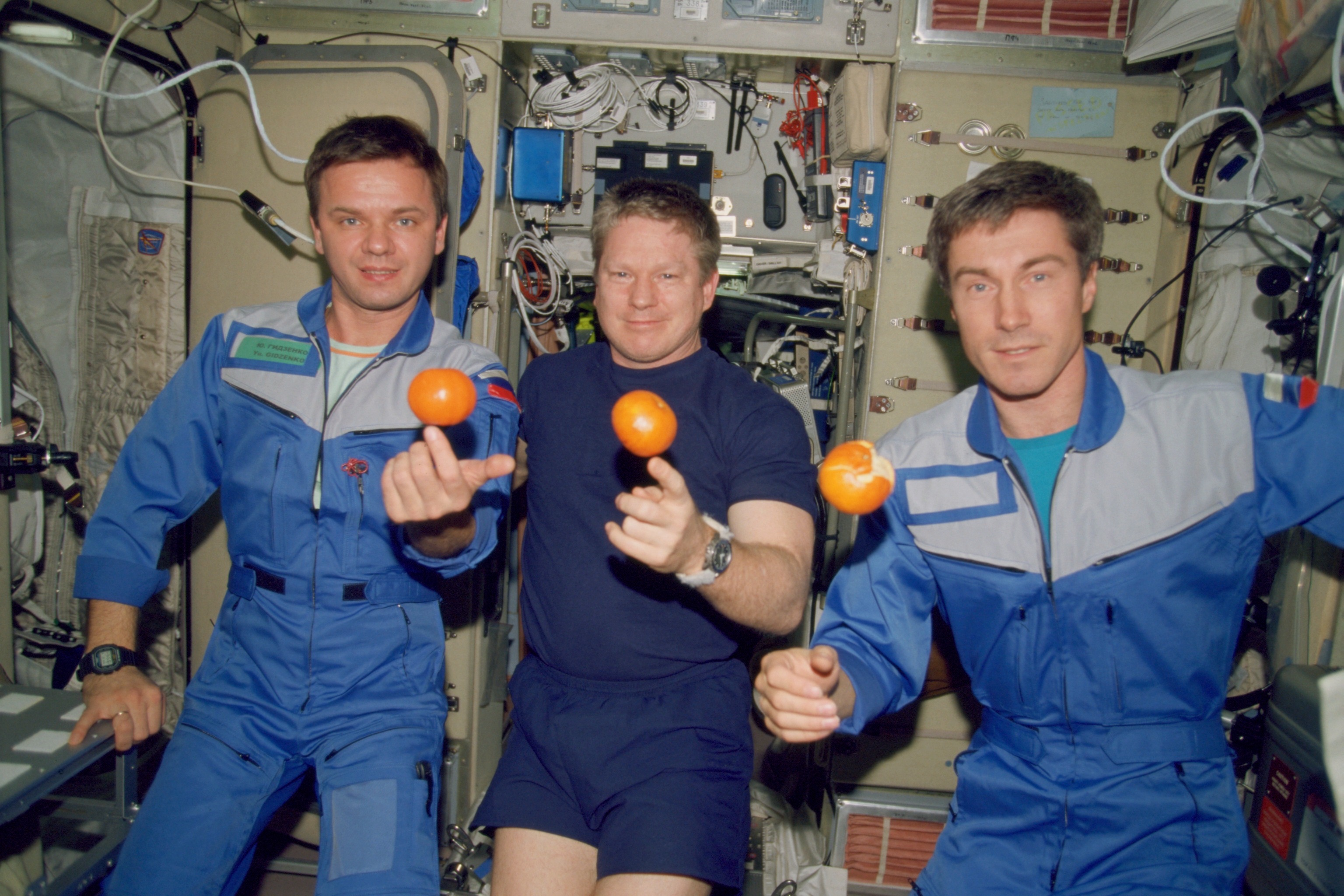 Bill Shepherd (center) and his Expedition 1 crewmates Yuri Gidzenko (left) and Sergei Krikalev juggle oranges during their time aboard the International Space Station. They celebrated both Christmas and the dawn of 2001 in orbit. Photo Credit: NASA
