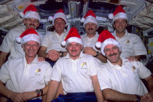 Displaying their Santa hats with pride as they celebrate a successful holiday period servicing the Hubble Space Telescope, the astronauts of STS-103 were the first - and only - Shuttle crew to spend Christmas in space. Photo Credit: NASA