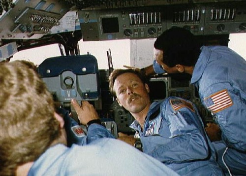 61C crewmen Steve Hawley, Robert 'Hoot' Gibson (facing camera) and Charlie Bolden demonstrate the cramped nature of Columbia's flight deck during the mission. Photo Credit: NASA