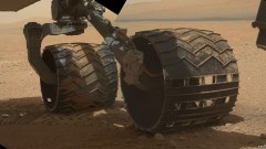 Curiosity's six wheels - two of them shown here - have already carried the rover nearly a mile from Bradbury Landing to the upcoming 'John Klein' drill site. Photo Credit: NASA