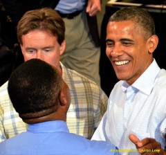 President Barack Obama greets former shuttle astronaut Winston Scott in this AmericaSpace stock photo. Photo Credit: Julian Leek / AmericaSpace